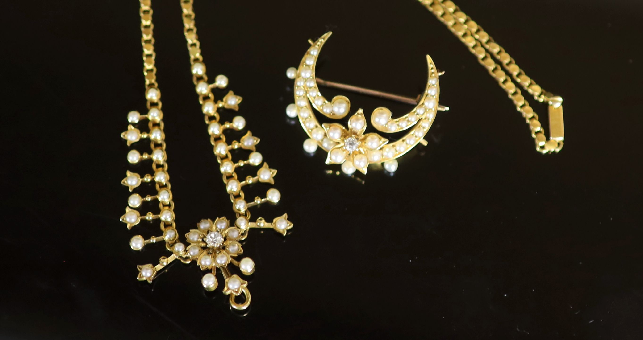 A Victorian gold, pearl and diamond set necklace, lacking drop, together with a similar crescent brooch